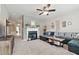 Spacious living room featuring neutral colored walls, fireplace, plush carpet, and contemporary decor at 771 Tulip Poplar Way, Lawrenceville, GA 30044