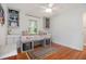 Bright bedroom features a bed nook with storage, hardwood floors, and a ceiling fan at 1747 Remington Rd, Atlanta, GA 30341