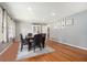 Bright dining room with hardwood floors, hutch, and space for eight around the table at 1747 Remington Rd, Atlanta, GA 30341