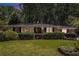 Charming brick home with manicured lawn and mature trees provides great curb appeal at dusk at 1747 Remington Rd, Atlanta, GA 30341