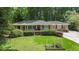 Charming brick home with a manicured lawn, mature bushes, and inviting curb appeal at 1747 Remington Rd, Atlanta, GA 30341