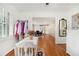 Bright hallway features hardwood floors, white trim, and a table with a colorful rug at 1747 Remington Rd, Atlanta, GA 30341
