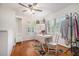 Sunlit hallway boasts hardwood floors, vintage-style table and seating, and unique decor elements at 1747 Remington Rd, Atlanta, GA 30341