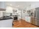 Renovated kitchen featuring white cabinets, stainless steel appliances, and dark countertops at 1747 Remington Rd, Atlanta, GA 30341