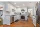 Updated kitchen with white cabinets, stainless appliances, subway tile, and sleek black countertops at 1747 Remington Rd, Atlanta, GA 30341