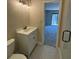 Bathroom featuring granite-look tile floor and a modern vanity at 731 Hanover Se Ln, Marietta, GA 30067