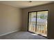 Carpeted bedroom featuring a sliding glass door to a balcony at 731 Hanover Se Ln, Marietta, GA 30067