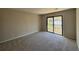Carpeted bedroom featuring a sliding glass door to a balcony at 731 Hanover Se Ln, Marietta, GA 30067