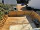 View of a wooden deck with privacy fence, partial building and green bushes at 731 Hanover Se Ln, Marietta, GA 30067