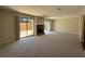 Living room featuring a stone fireplace and sliding glass doors to the outside patio at 731 Hanover Se Ln, Marietta, GA 30067