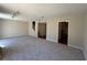 Spacious living room featuring neutral paint, plush carpeting, and ample natural light at 731 Hanover Se Ln, Marietta, GA 30067