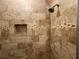 The shower has tiled walls accented with a decorative tile border and a shampoo nook at 731 Hanover Se Ln, Marietta, GA 30067