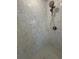 This shower features stylish marble-look tile and a modern shower head at 731 Hanover Se Ln, Marietta, GA 30067