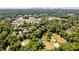 Wide aerial view of a lush neighborhood, pond, and the city skyline at 1001 Dancing Fox Rd, Decatur, GA 30032