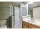 Bathroom features a tiled shower with glass door, white vanity, and a mirror at 1001 Dancing Fox Rd, Decatur, GA 30032