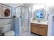 Bright bathroom features a shower with glass door and oak vanity at 1001 Dancing Fox Rd, Decatur, GA 30032