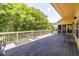 A spacious wooden deck offers an outdoor living space overlooking a green landscape at 1001 Dancing Fox Rd, Decatur, GA 30032