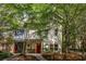 Charming two-story home with well-maintained lawn and mature trees offering shade at 1001 Dancing Fox Rd, Decatur, GA 30032