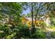 Exterior view showcasing the home with mature landscaping and architectural detail at 1001 Dancing Fox Rd, Decatur, GA 30032
