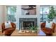 Cozy living room featuring a fireplace, comfortable seating, and natural light at 1001 Dancing Fox Rd, Decatur, GA 30032
