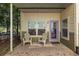 Charming front porch with seating, a purple front door, and curb appeal at 1001 Dancing Fox Rd, Decatur, GA 30032