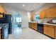 Functional kitchen with black appliances, wood cabinets, and tile flooring at 1001 Dancing Fox Rd, Decatur, GA 30032