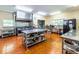 A well-equipped commercial kitchen features stainless steel appliances, workspaces, and ample storage at 1001 Dancing Fox Rd, Decatur, GA 30032