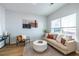Comfortable living room features a neutral color palette and lots of natural light at 1001 Dancing Fox Rd, Decatur, GA 30032