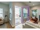 Open door to patio features a decorative ladder and bright purple frame at 1001 Dancing Fox Rd, Decatur, GA 30032