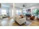 Bright living room with fireplace, ceiling fan, and lots of natural light at 1001 Dancing Fox Rd, Decatur, GA 30032