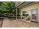 Charming patio with chairs, complemented by a walkway through gravel at 1001 Dancing Fox Rd, Decatur, GA 30032