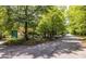 Picturesque street view with mature trees and clear signage, creating a welcoming atmosphere at 1001 Dancing Fox Rd, Decatur, GA 30032