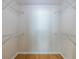 Empty walk-in closet with wood floors and wire shelving at 1001 Dancing Fox Rd, Decatur, GA 30032