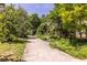 Serene walkway lined with lush landscaping and mature trees, offering a peaceful walking experience at 1001 Dancing Fox Rd, Decatur, GA 30032