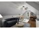 This finished attic boasts unique ceiling, making it an ideal flexible living space at 1974 Skyland Glen Dr, Snellville, GA 30078