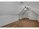 An unfinished attic space offers the opportunity for storage, customization, and expansion at 1974 Skyland Glen Dr, Snellville, GA 30078