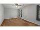 This spacious bedroom features neutral walls, ceiling fan and large windows with ample natural light at 1974 Skyland Glen Dr, Snellville, GA 30078