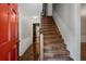 Inviting foyer with a staircase and a glimpse into the home's interior at 1974 Skyland Glen Dr, Snellville, GA 30078