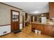 Spacious mudroom or transition area with hardwood flooring, desk, and exterior door at 1974 Skyland Glen Dr, Snellville, GA 30078