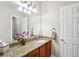 The bathroom features granite counters and a large mirror at 2548 Westchester Se Way, Conyers, GA 30013