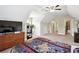 Large bedroom with a desk, bed and view of the en suite bathroom at 2548 Westchester Se Way, Conyers, GA 30013
