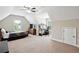 Spacious bedroom with multiple windows and a desk and entertainment center at 2548 Westchester Se Way, Conyers, GA 30013