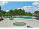 Large pool with ample lounge seating, and jacuzzi offering a resort-style living experience in a vibrant community at 2548 Westchester Se Way, Conyers, GA 30013