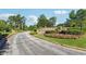 Welcoming entrance to Westchester Lakes with lush landscaping, flowers, and stone signage, creating a beautiful approach at 2548 Westchester Se Way, Conyers, GA 30013