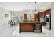 Modern kitchen with granite countertops, stainless steel appliances, and a central island with seating for cooking and gathering at 2548 Westchester Se Way, Conyers, GA 30013