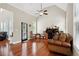 Comfortable living area with vaulted ceilings, hardwood floors, large windows, and a functional workspace at 2548 Westchester Se Way, Conyers, GA 30013