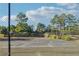 Tennis courts enclosed by fencing and greenery, offering a private and enjoyable space for sports and recreation at 2548 Westchester Se Way, Conyers, GA 30013