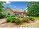 Private backyard with patio, pergola, nice plantings and manicured lawn at 3633 Gilpin Ct, Lawrenceville, GA 30044