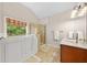 Bright bathroom featuring a walk-in tub, shower, and tile floor at 3633 Gilpin Ct, Lawrenceville, GA 30044