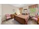 Cozy bedroom featuring antique furniture, a comfortable bed with decorative pillows, and bright, natural light at 3633 Gilpin Ct, Lawrenceville, GA 30044